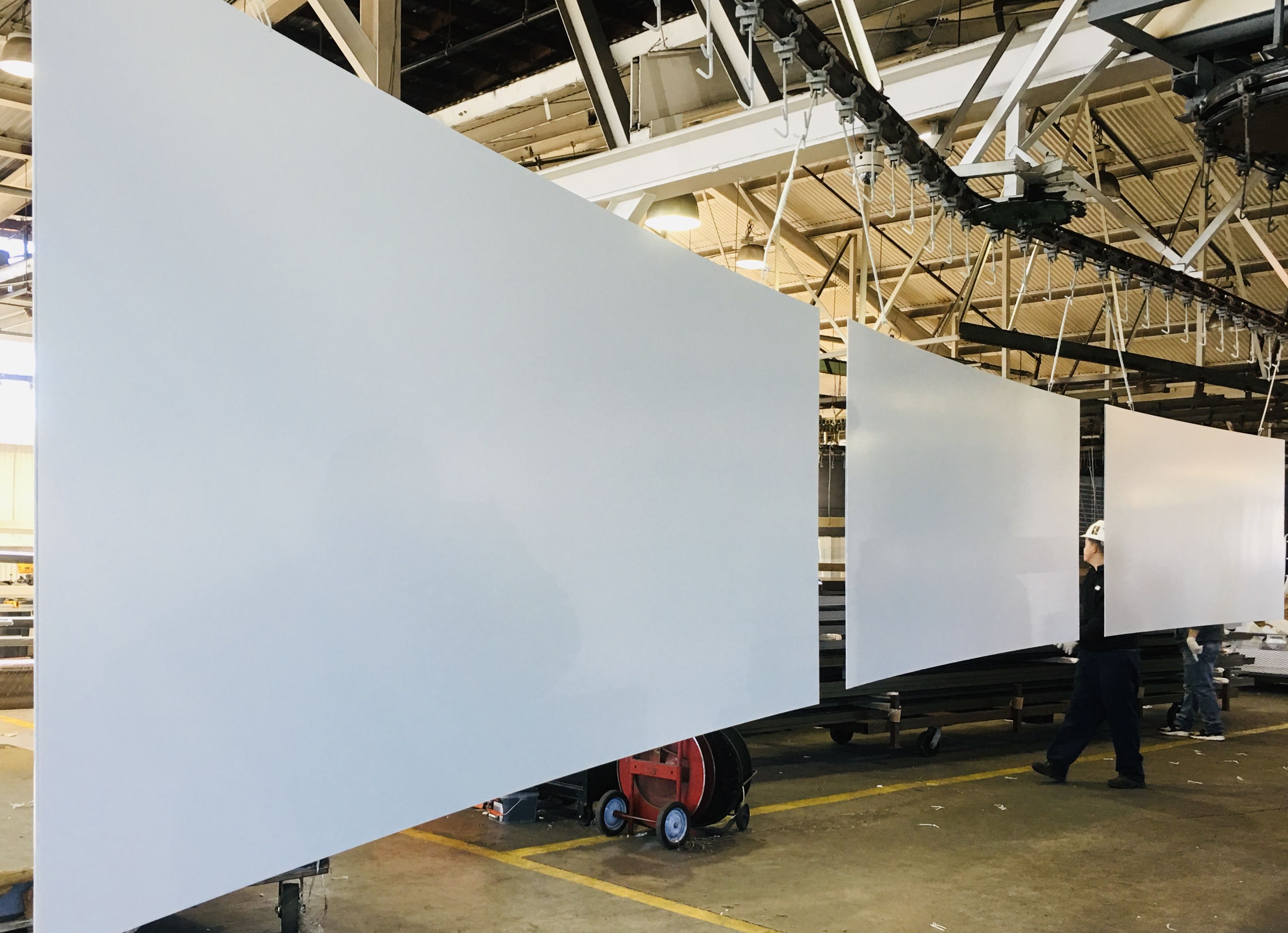 Three pieces of white coated metal panels